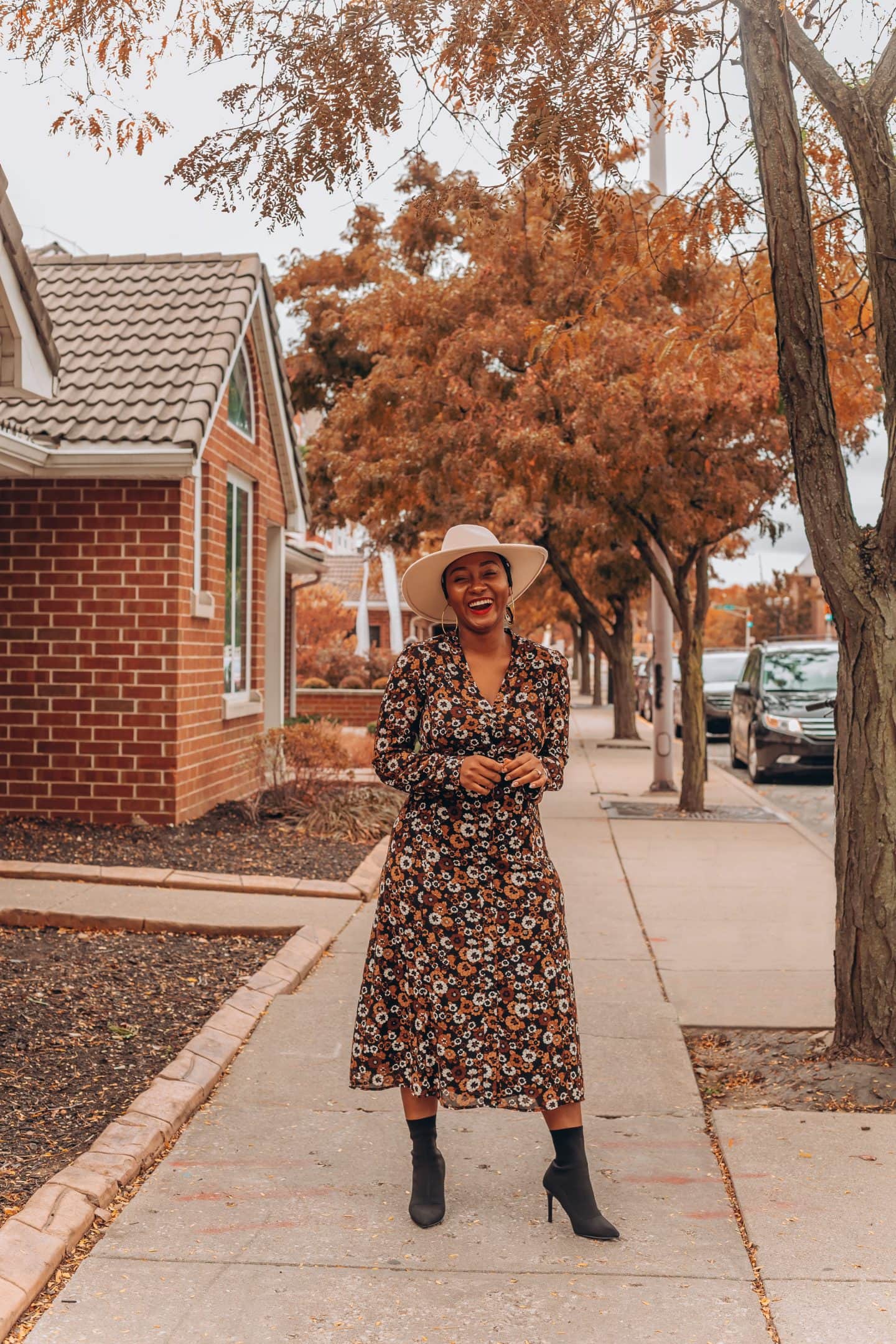 Fall dress outfit featured by top Indianapolis life and style blogger, Tales and Turbans: image of a woman wearing a Stitch Fix floral maxi dress and Zara boots.