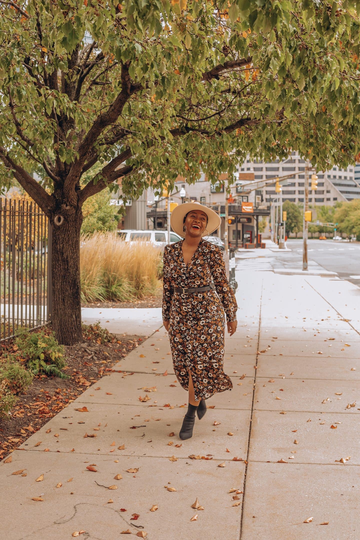 Fall dress outfit featured by top Indianapolis life and style blogger, Tales and Turbans: image of a woman wearing a Stitch Fix floral maxi dress and Zara boots.