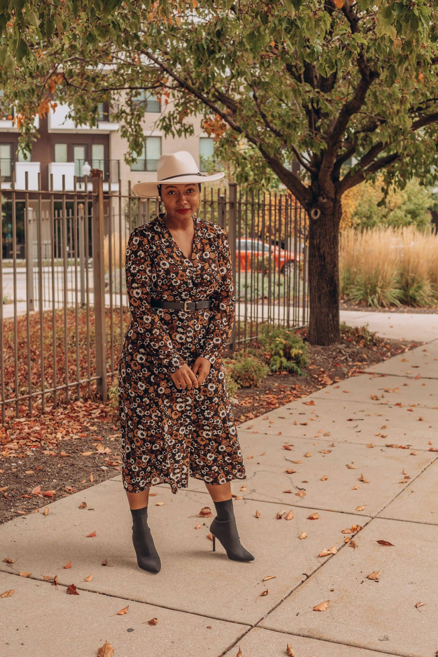 Fall dress outfit featured by top Indianapolis life and style blogger, Tales and Turbans: image of a woman wearing a Stitch Fix floral maxi dress and Zara boots.